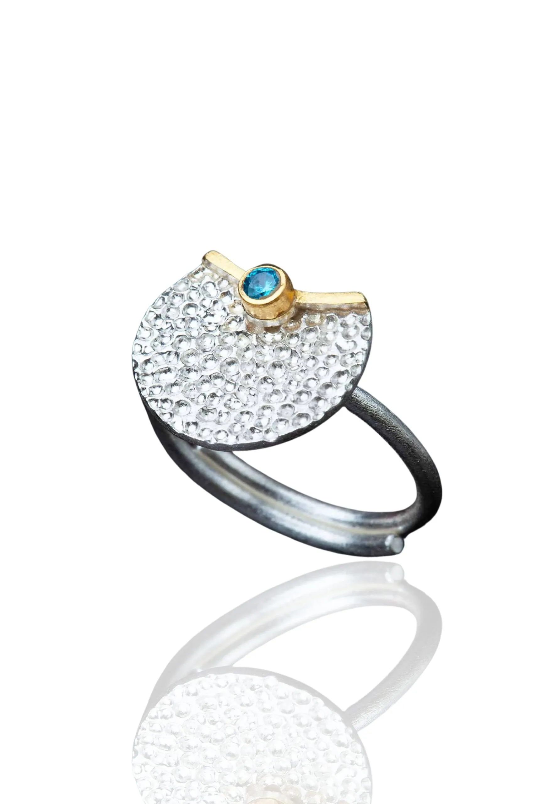 Handmade Jewellery | Round silver ring with blue zircon main