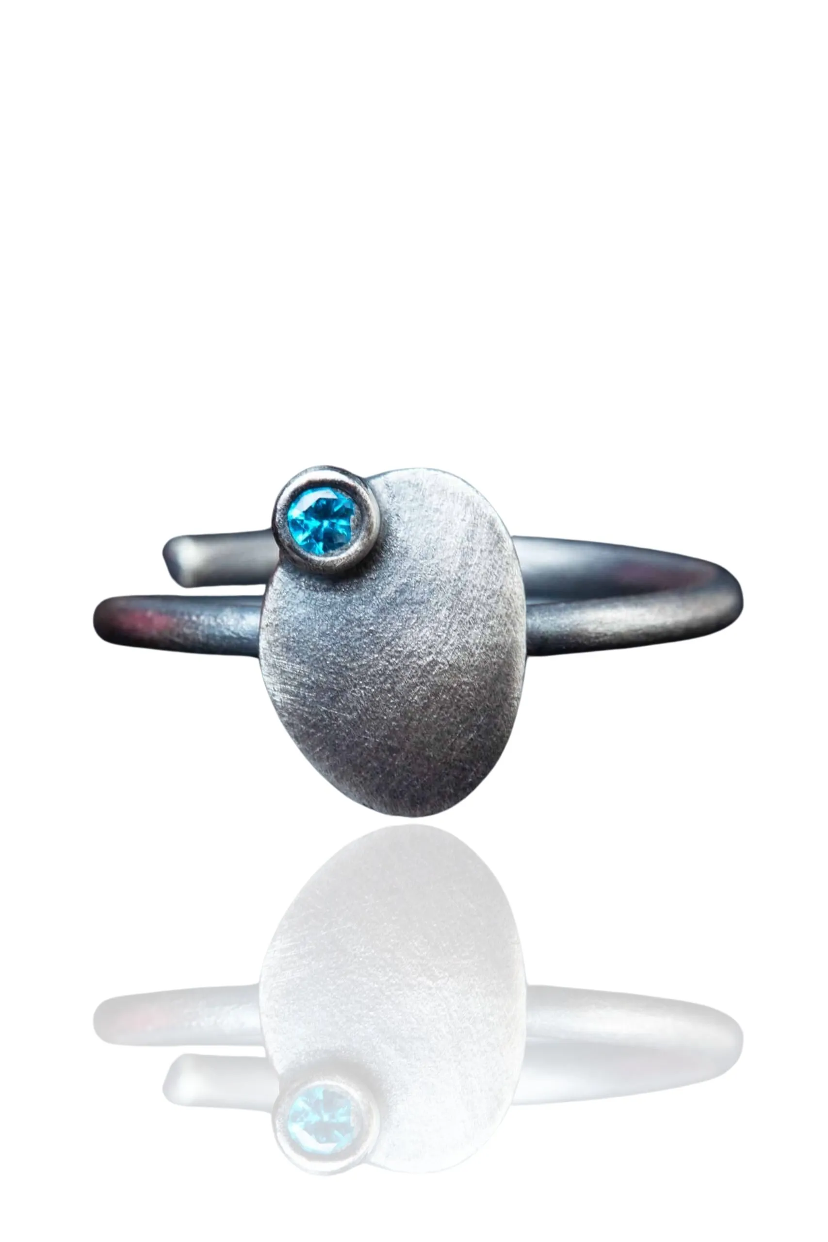 Handmade Jewellery | Oval silver ring with blue zircon main
